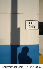 Pittsburgh, PA USA. January 5, 2022. Shadow Of Person Seen During The Daytime Near An Exit Only Sign On Liberty Avenue In A Pittsburgh Neighborhood.