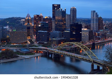 Pittsburgh, PA, USA May 5 The lights of Pittsburgh Pennsylvania begin to illuminate against a dusk sky