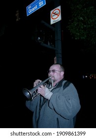 Pittsburgh, PA USA. October 23, 2011. Older Man Playing The Trumpet On A Street Corner In Downtown Pittsburgh, Pennsylvania.