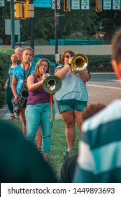 Pittsburgh, Pennsylvania / United States - 7-12-19: Two Women Play Instruments For The Crowd At The Lights For Liberty Vigil