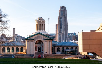 Pittsburgh, Pennsylvania, USA 12/7/19 The Electrical and Computer Engineering building on the campus of Carnegie Mellon University with the Cathedral of Learning from the U of Pittsburgh behind it