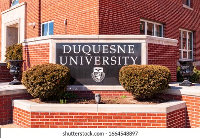 Pittsburgh, Pennsylvania, USA 3/1/20 The Duquesne University Sign On Campus On A Sunny Winter Day