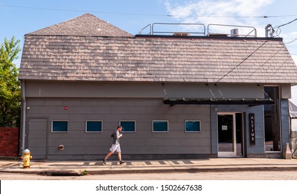 Pittsburgh, Pennsylvania, USA 9/8/2019 Altius Restaurant On Grandview Avenue In The Mt Washington Neighborhood With A Man Jogging In Front Of It On A Sunny Day