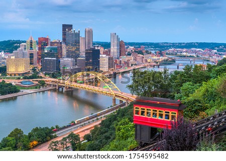 Pittsburgh, Pennsylvania, USA downtown skyline with the incline from Mt. Washington at twilight.
