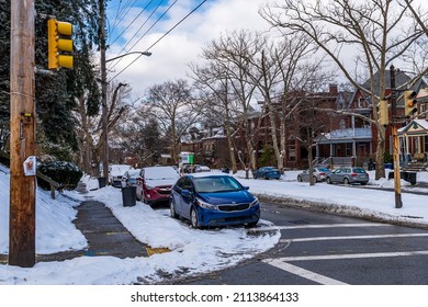 Pittsburgh, Pennsylvania, USA January 25, 2022 Thomas Boulevard in the Point Breeze neighborhood with snow cover on a sunny winter day