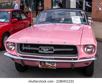 Pittsburgh, Pennsylvania, USA July 18, 2022 A 1967 pink Ford Mustang at the Shadyside car show associated with the Pittsburgh Grand Prix