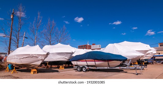 Pittsburgh, Pennsylvania, USA March 7, 2021 Boats wrapped in plastic and dry-docked for winter at a marina on the north side next to the Ohio river