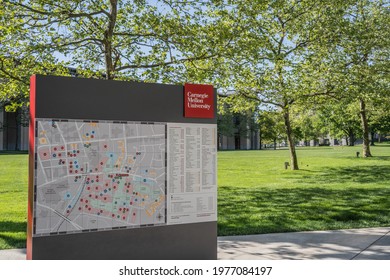 Pittsburgh, Pennsylvania, USA- May 13, 2021: Carnegie Mellon University map and sign with campus in the background