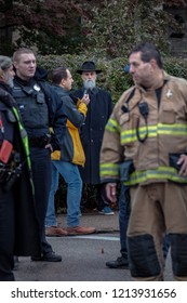 Pittsburgh, Pennsylvania / USA – Oct 27 2018: A Man Watches On As First Responders Arrive At The Scene Of Saturday's Deadly Synagogue Shooting In Pittsburgh PA.