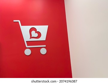 Pittsburgh, Pennsylvania, USA - October 31, 2021: A shopping cart with Burlington Coat Factory logo on it on the wall.  