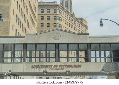 Pittsburgh, Pennsylvania, USA-April 8, 2022: Students can use an elevated crosswalk over Forbes Avenue on the campus of the University of Pittsburgh.
