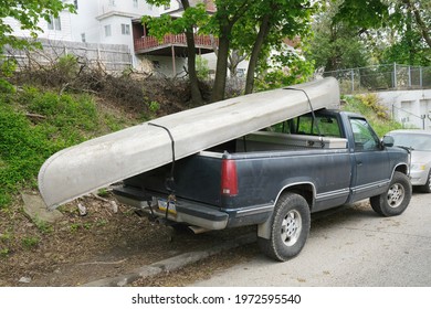 Pittsburgh,PA USA. April 28, 2021. Older Open Bed Truck With A Canoe On Top Is Seen Parked In The Carrick Neighborhood Of Pittsburgh,PA.