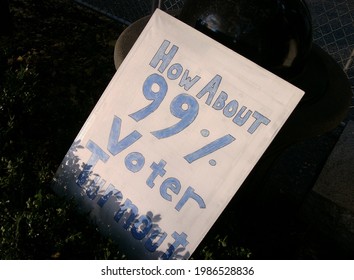 Pittsburgh,PA USA. October 14, 2011. Sign Leaning On Brush At A Park To Encourage Voter Turnout In Elections By The Majority Of People.