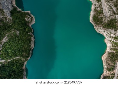 Piva Lake - Amazing Mountain View in Montenegro - Alps Landscape - turquoise blue water on Balkan between rocks TOP DOWN Aerial Shot Drone