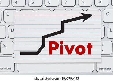 Pivot Message With Arrow An Index Card On A Gray Keyboard 