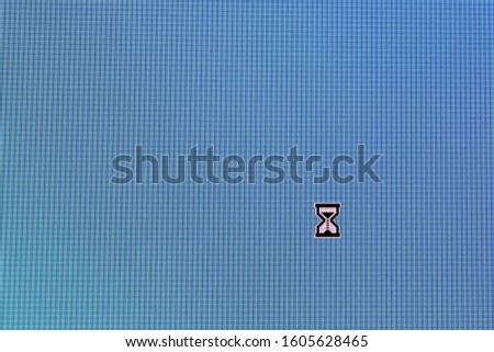 Pixel cursors icons:  busy cursor on blue screen.