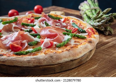  pizza asparagus and ham rustic background