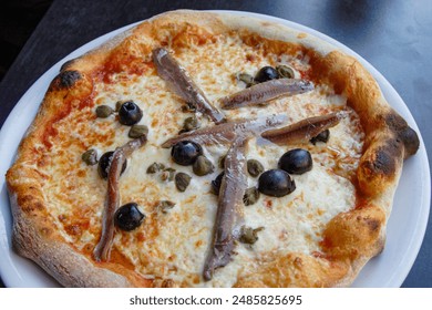 Pizza with Black Olive, Capers and Anchovy - Powered by Shutterstock