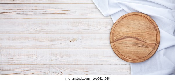 Pizza board and table cloth on wood texture abstract vintage backdrop. Rustic background. top view.