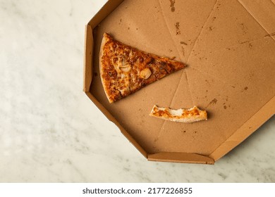 Pizza Box, On The Table, With One Piece And A Crust, Leftovers, Top View, No People,