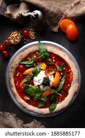 Pizza With Burrata Cheese And Pine Nuts. Italian Pizza. Metal Plate For Serving. Green Basil Leaves. Vertical Photo. Top View.