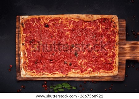 Pizza by the slice in a rectangular pan, pre-portioned. Traditional food, restaurants, street food, and Mediterranean cuisine. Ideal for publishing, advertising, and food design.