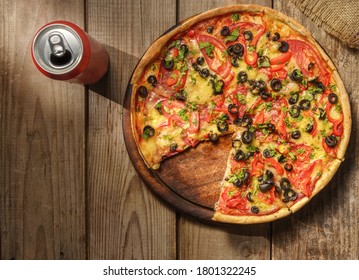 Pizza And Can Of Beer (soda) On The Table Top View