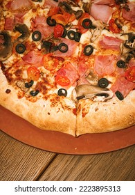 Pizza Capriciosa With Cheese Stuffed Crust In Pizzeria, Food Close-up