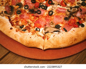 Pizza Capriciosa With Cheese Stuffed Crust In Pizzeria, Food Close-up