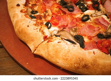 Pizza Capriciosa With Cheese Stuffed Crust In Pizzeria, Food Close-up