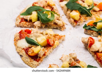Pizza With Cauliflower Base, Chicken, Rucola Leaves, Cherry Tomatoes And Mozzarella Cheese On White Background Top View