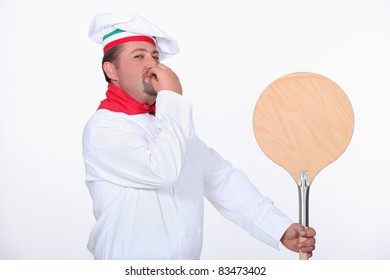 Pizza Chef With A Wooden Peel