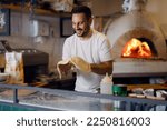 Pizza chef working in the kitchen