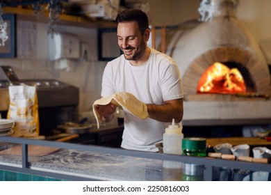 Pizza chef working in the kitchen