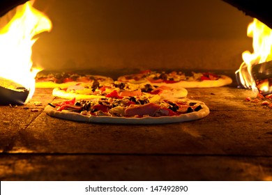Pizza cooking in a tradition oven