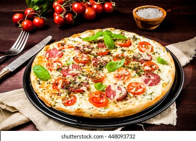 Pizza With Cream Cheese Basil, Tomato And Salami