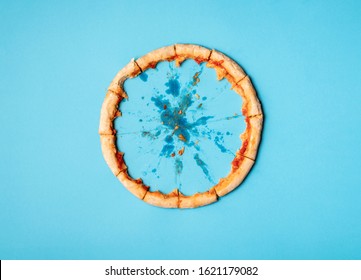 Pizza crust in a circle on blue background and grease traces. Flat lay of just pizza crust and crumbs. Eaten pizza context. Diet pizza funny concept. - Shutterstock ID 1621179082