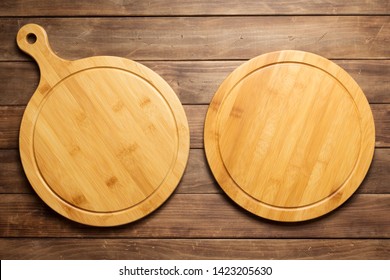 Pizza Cutting Board At Rustic Wooden Plank Board Background, Top View