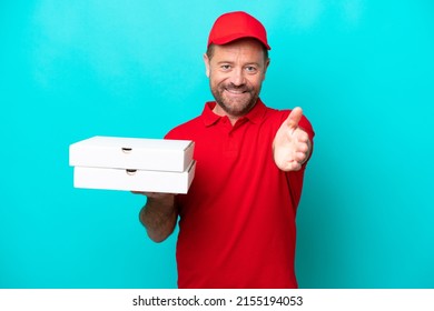 Pizza Delivery Man With Work Uniform Picking Up Pizza Boxes Isolated On Blue Background Shaking Hands For Closing A Good Deal