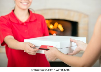 Pizza Delivery Woman Receiving Payment. Close-up.