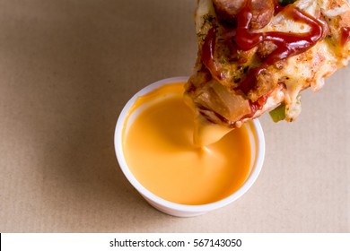 Pizza with dipping sauce.