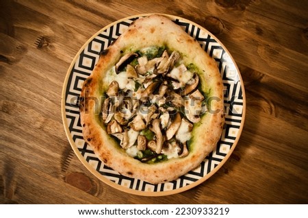 Pizza Funghi: pomodoro sauce, pesto, paris mushrooms, portobello mushrooms, shimeji mushrooms and thyme.