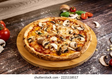 Pizza funghi with tomato sauce, mozzarella and fresh mushrooms - Powered by Shutterstock