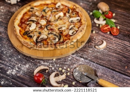 Pizza funghi with tomato sauce, mozzarella and fresh mushrooms