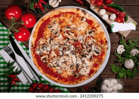 Pizza funghi with tomato sauce, mozzarella and fresh mushrooms