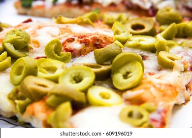 Pizza With Green Olives In Macro