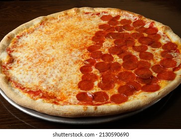 Pizza with half pepperoni and half plain