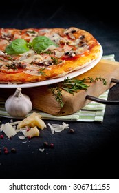 Pizza With Ham And Mushrooms On Dark Background