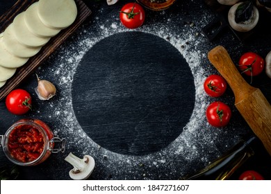  Pizza Ingredients On Black Background, Free Space For Text