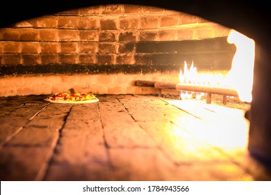 
Pizza Inside Brick Oven With Extra Cheese